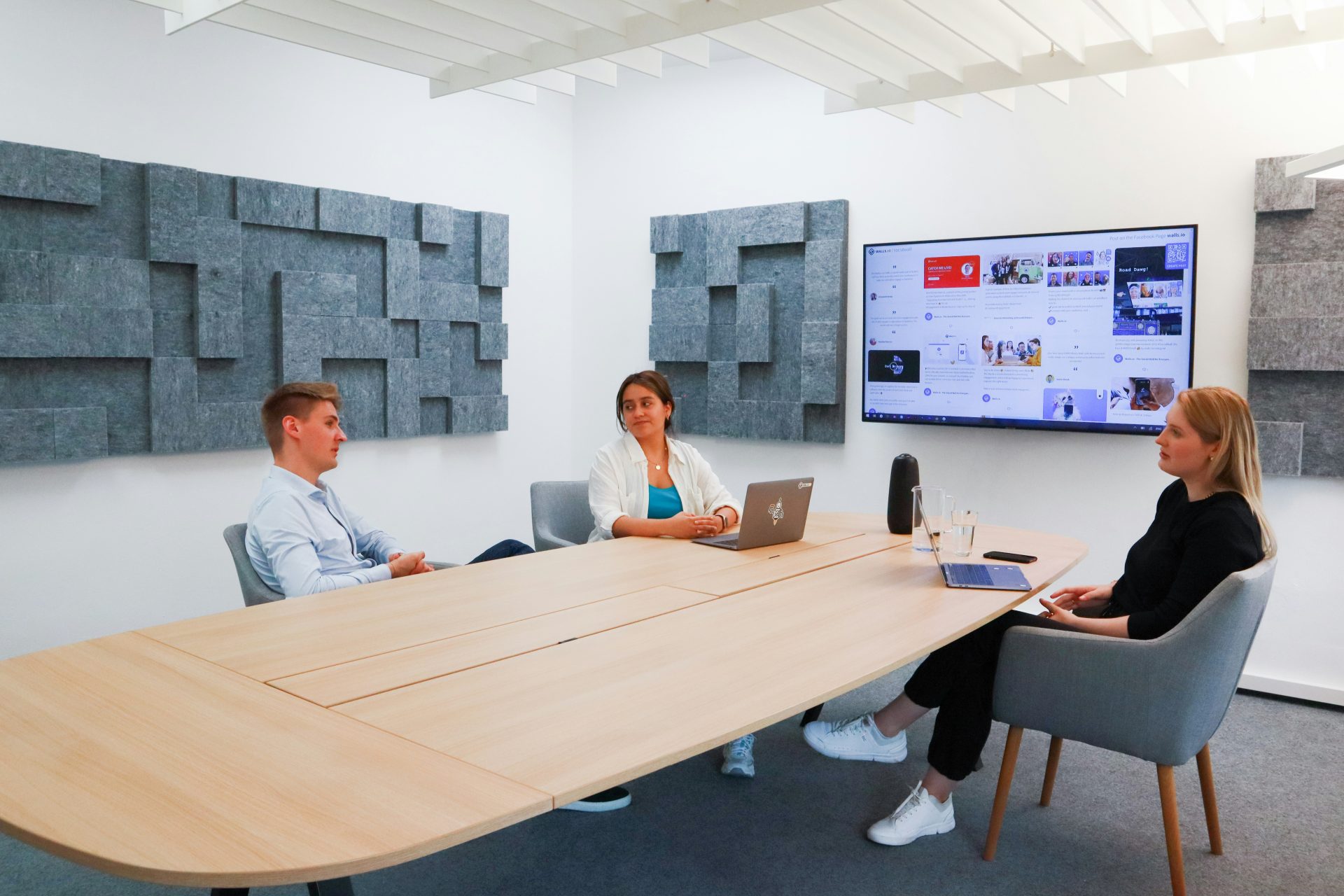 a group of people sitting around a conference table